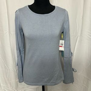 NWT A beautiful light blue sweater with cutouts on the arms.